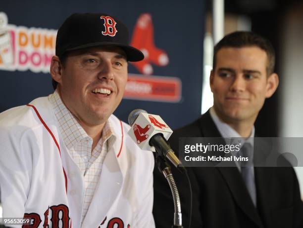 John Lackey of the Boston Red Sox speaks as general manager Theo Epstein smiles during a press conference introducing Lackey as a member of the Red...