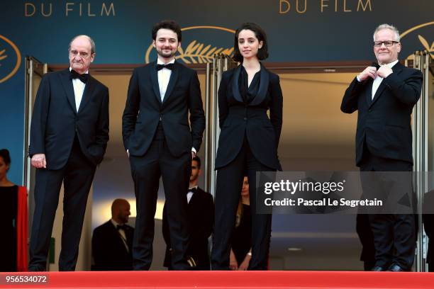 Cannes Film Festival President Pierre Lescure, Director A.B. Shawky , and producer Dina Emam and Cannes Film Festival Director Thierry Fremaux fixing...