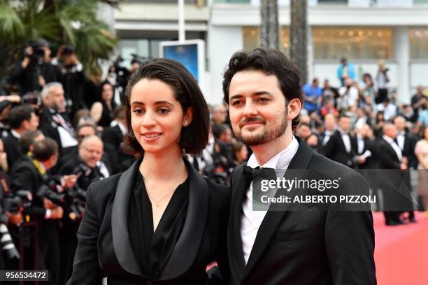 Egyptian director A.B Shawky and Dina Emam pose as they arrive on May 9, 2018 for the screening of the film "Yomeddine" at the 71st edition of the...