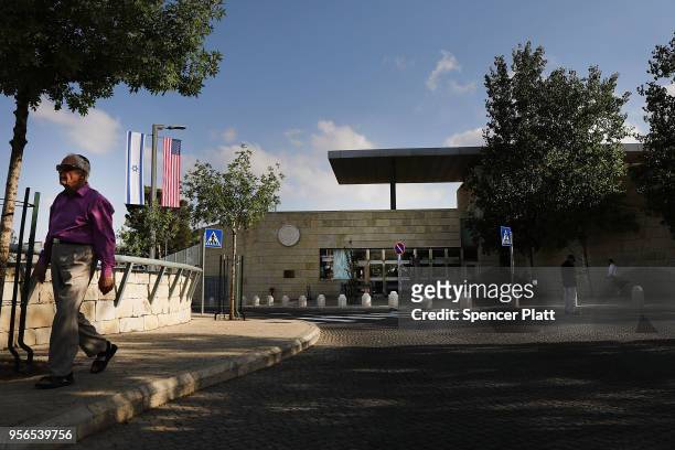 Man walks by the entrance to the new American embassy in Jerusalem which is scheduled to open next week on May 9, 2018 in Jerusalem, Israel. In a...