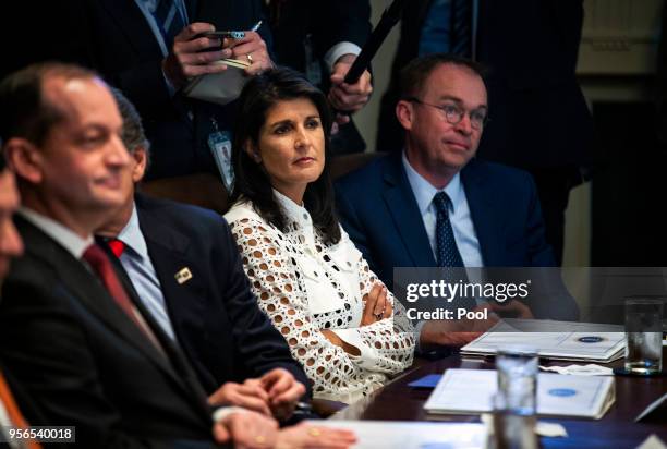 Ambassador to the United Nations Nikki Haley and Director of the Office of Management and Budget Mick Mulvaney listen as President Donald Trump...