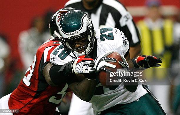 LeSean McCoy of the Philadelphia Eagles against Curtis Lofton of the Atlanta Falcons at Georgia Dome on December 6, 2009 in Atlanta, Georgia.