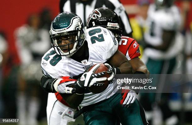 LeSean McCoy of the Philadelphia Eagles against Curtis Lofton of the Atlanta Falcons at Georgia Dome on December 6, 2009 in Atlanta, Georgia.