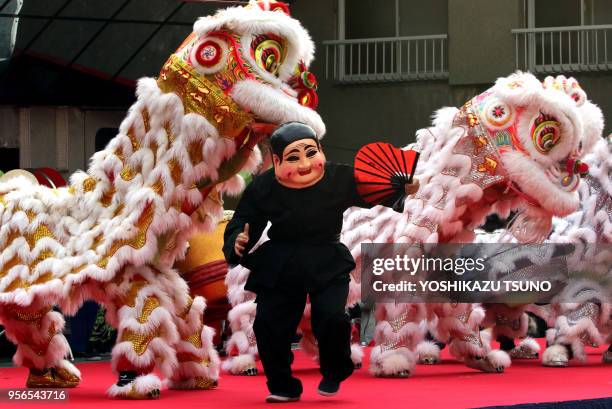 Chinese residents in Japan perform lion dance to celebrate Chinese Lunar New Year at Yokohama Chinatown in Yokohama, suburban Tokyo on January 29,...