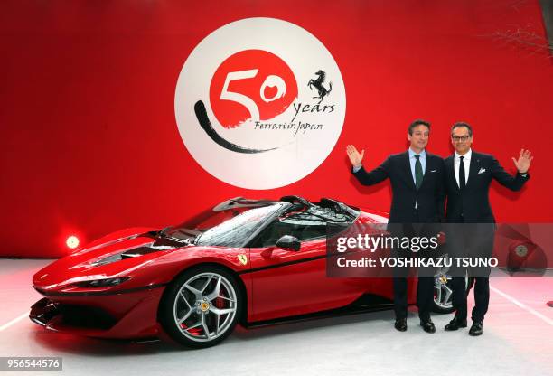 Italian sports car maker Ferrari senior vice president and chief designer Fravio Manzoni and senior vice president and chief marketing officer Enrico...