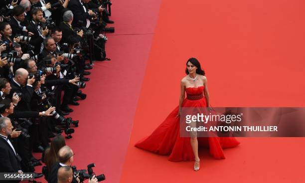 Romanian model Catrinel Menghia poses as she arrives on May 9, 2018 for the screening of the film "Yomeddine" at the 71st edition of the Cannes Film...