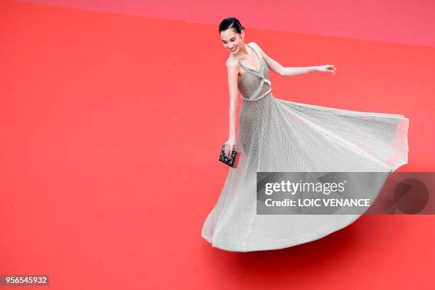 Japanese model Kiko Mizuhara poses for photographers as she arrives on May 9, 2018 for the screening of the film "Yomeddine" at the 71st edition of...