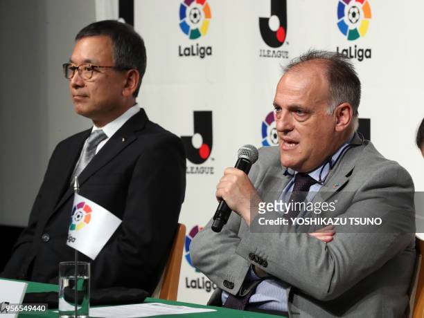 Spanish professional football league LaLiga president Javier Tebas speaks while Japan Professional Football League chairman Mitsuru Murai looks on as...