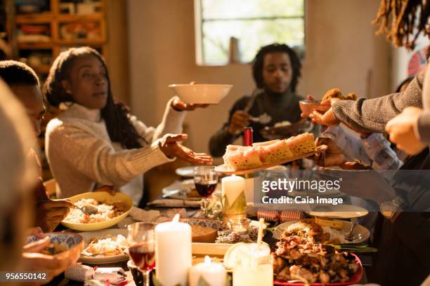 Family passing food at Christmas dinner