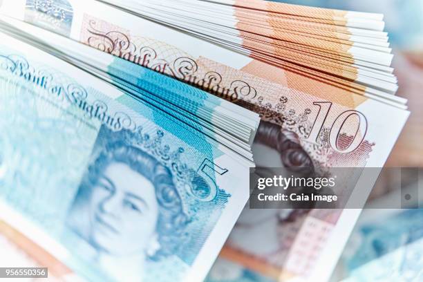 five and ten pound note stacks - stack of pound notes stock pictures, royalty-free photos & images