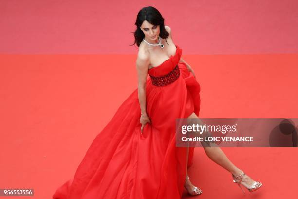 Romanian model Catrinel Menghia poses as she arrives on May 9, 2018 for the screening of the film "Yomeddine" at the 71st edition of the Cannes Film...