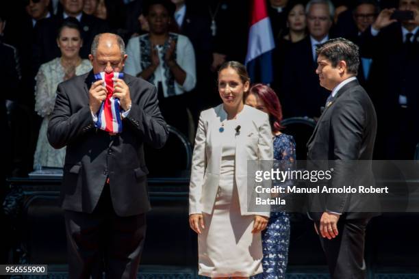 Outgoing President Luis Guillermo Solis, kisses the Presidential sash before Carolina Hidalgo President of the Congress hands it over to newly...