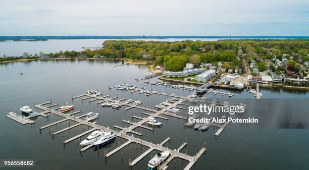the aerial scenic view on the marina of port washington, long island, new york, usa - long island stock pictures, royalty-free photos & images