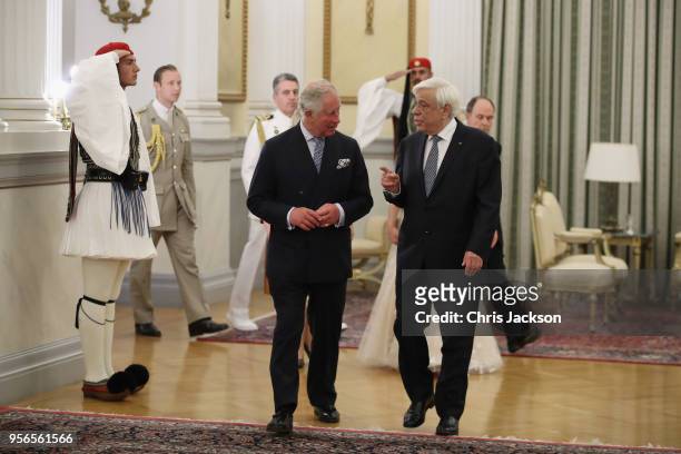 Prince Charles, Prince of Wales speaks with the President of Greece Prokopis Pavlopoulos as they attend an Official Dinner at the Presidential...