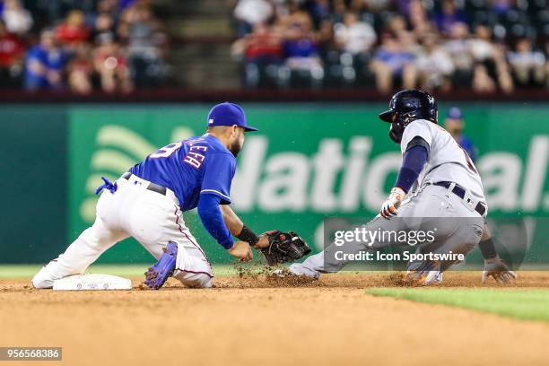 Texas Rangers second baseman Isiah Kiner-Falefa catches the baseball during a steal attempt by Detroit Tigers shortstop Jose Iglesias during the game...