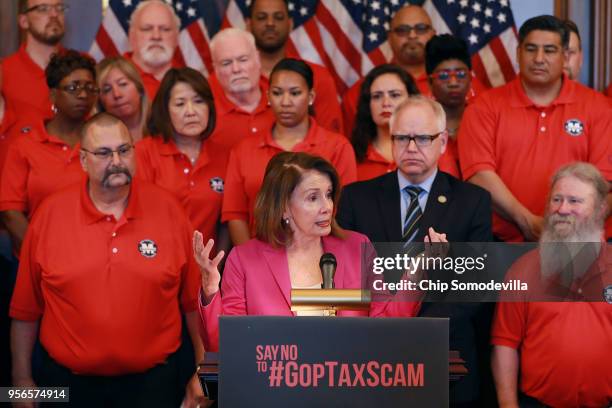 House Minority Leader Nancy Pelosi addresses members of the Machinists Union International with union president Robert Martinez and Rep. Tim Walz in...