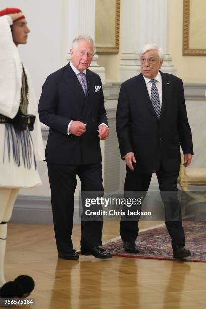 Prince Charles, Prince of Wales speaks with the President of Greece Prokopis Pavlopoulos as they arrive for an Official Dinner at the Presidential...