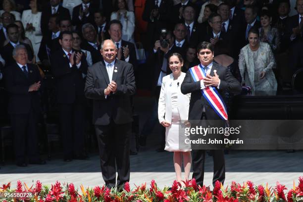 Carlos Alvarado elected President of Costa Rica greets supportes after receiving the presidential sash alonside current former president Luis...