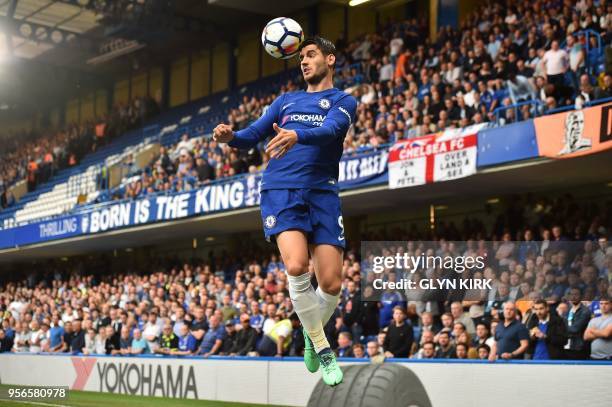 Chelsea's Spanish striker Alvaro Morata heads the ball during the English Premier League football match between Chelsea and Huddersfield Town at...