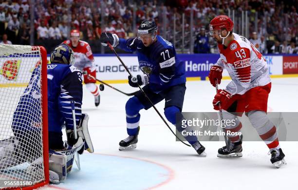Markus Nutivaara of Finland and Nichlas Hardt of Denmark battle for the puck during the 2018 IIHF Ice Hockey World Championship group stage game...
