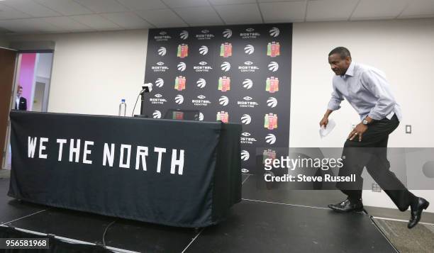 Toronto Raptors head coach Dwane Casey jumps up on the podium as the Toronto Raptors hold media availability after being eliminated by the Cleveland...