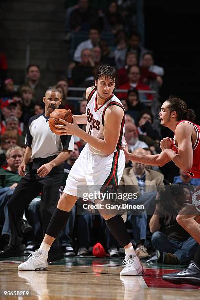 Andrew Bogut of the Milwaukee Bucks posts up against Joakim Noah of the Chicago Bulls on January 8, 2010 at the Bradley Center in Milwaukee,...