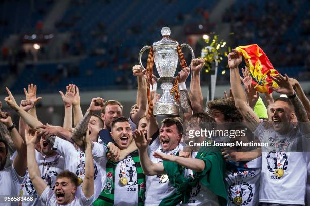 David Yurchenko of FC Tosno lifts the trophy during Russian Cup Final match between FC Tosno and Fc Avangard at Volgograd Arena on May 9, 2018 in...