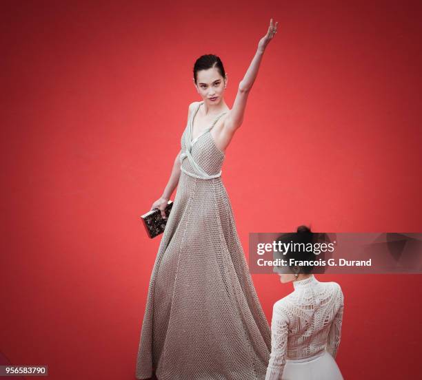 Kiko Mizuhara and Wang Likun attend the screening of 'Yomeddine' during the 71st annual Cannes Film Festival at Palais des Festivals on May 9, 2018...