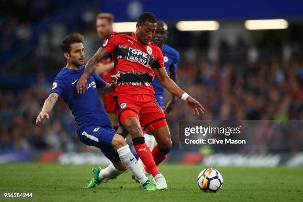 Cesc Fabregas of Chelsea tackles Rajiv van La Parra of Huddersfield Town during the Premier League match between Chelsea and Huddersfield Town at...