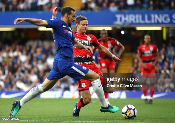 Davide Zappacosta of Chelsea battles for possession with Chris Lowe of Huddersfield Town during the Premier League match between Chelsea and...