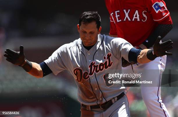 Mikie Mahtook of the Detroit Tigers hits a triple against the Texas Rangers in the first inning at Globe Life Park in Arlington on May 9, 2018 in...