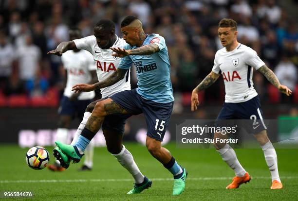Moussa Sissoko of Tottenham Hotspur is challenged by Kenedy of Newcastle United during the Premier League match between Tottenham Hotspur and...