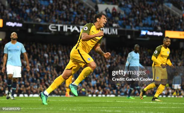 Leonardo Ulloa of Brighton and Hove Albion celebrates after scoring his sides first goal during the Premier League match between Manchester City and...