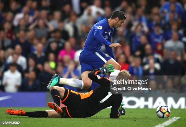 Alvaro Morata of Chelsea attempts to take the ball around Kasper Schmeichel of Leicester City during the Premier League match between Chelsea and...