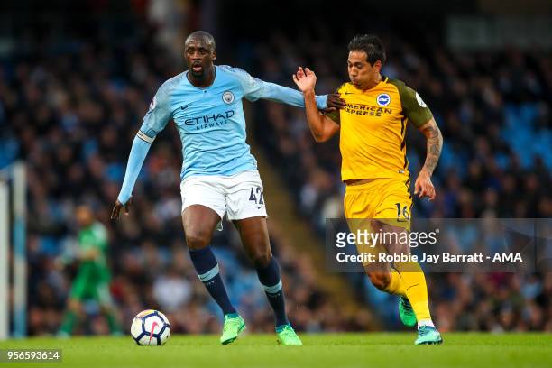 Yaya Toure of Manchester City and Leonardo Ulloa of Brighton & Hove Albion during the Premier League match between Manchester City and Brighton and...