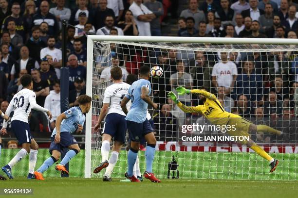 Newcastle United's English defender Jamaal Lascelles has a header saved by Tottenham Hotspur's French goalkeeper Hugo Lloris during the English...