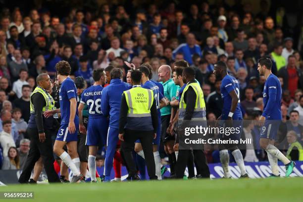 The Chelsea team argue with referee Lee Mason at half time during the Premier League match between Chelsea and Huddersfield Town at Stamford Bridge...