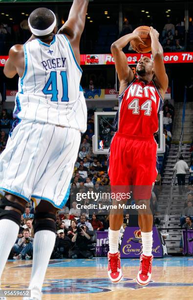 Trenton Hassell of the New Jersey Nets shoots over James Posey of the New Orleans Hornets on January 8, 2010 at the New Orleans Arena in New Orleans,...