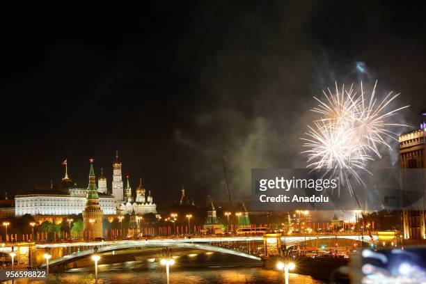 Fireworks illuminate the sky as Kremlin Palace is seen at the background during the 73rd anniversary of the victory over Nazi Germany in the...
