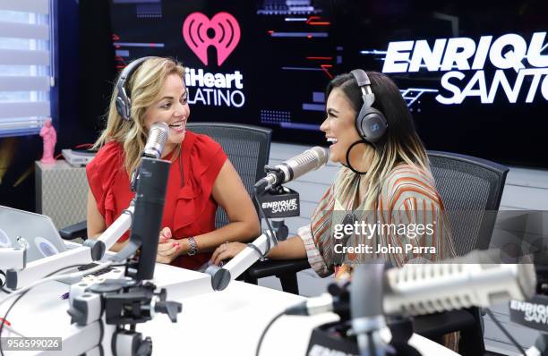 Gina Ulmos and Karol G attend The Enrique Santos Show At I Heart Latino Studios on May 9, 2018 in Miramar, Florida.