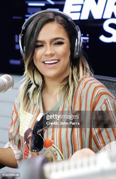 Karol G attends The Enrique Santos Show At I Heart Latino Studios on May 9, 2018 in Miramar, Florida.