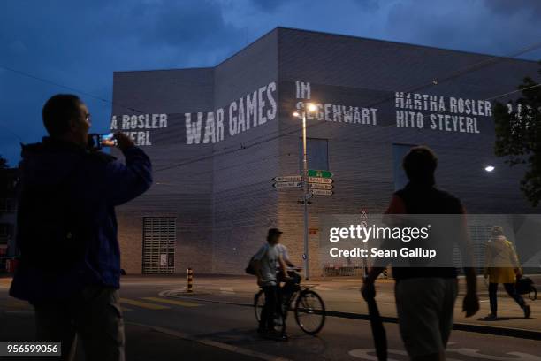 People walk past the modern wing of the Kunstmuseum Basel art museum on May 9, 2018 in Basel, Switzerland. Basel, a quiet university town on the...