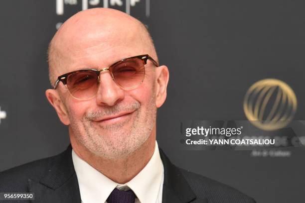 French director Jacques Audiard poses prior to take part in an award giving ceremony from the French Association of Filmmakers , honoring US director...
