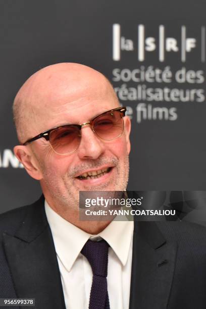 French director Jacques Audiard poses prior to take part in an award giving ceremony from the French Association of Filmmakers , honoring US director...