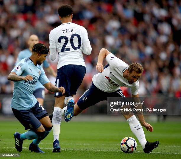 Tottenham Hotspur's Harry Kane and Dele Alli battle for the ball with Newcastle United's DeAndre Yedlin during the Premier League match at Wembley...