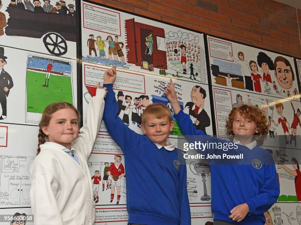 Pictured are local school children show off their contribution as part of Liverpool Football Club's 125th anniversary Red Neighbours, dot-art and...