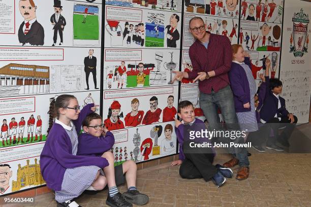 Pictured are local school children with artist David Andrews as part of Liverpool Football Club's 125th anniversary Red Neighbours, dot-art and...