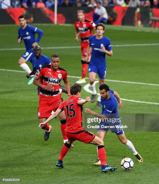 Pedro of Chelsea battles for possession with Mathias Jorgensen of Huddersfield Town during the Premier League match between Chelsea and Huddersfield...