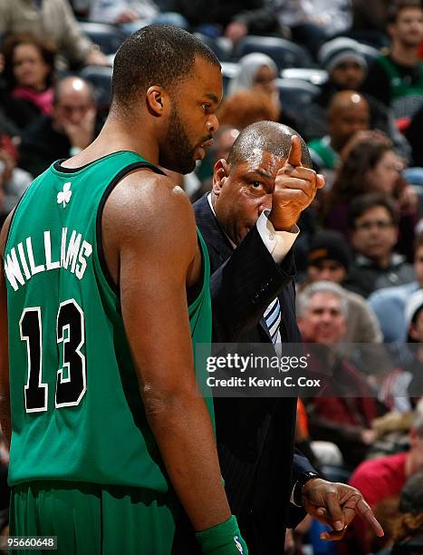 Head coach Doc Rivers of the Boston Celtics talks with Shelden Williams during the game against the Atlanta Hawks at Philips Arena on January 8, 2010...