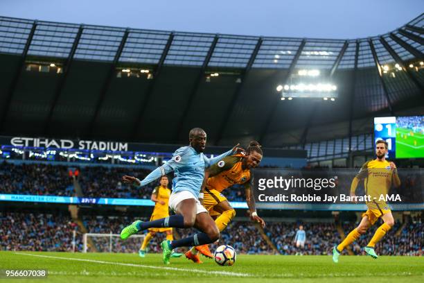Yaya Toure of Manchester City and Gaetan Bong of Brighton & Hove Albion during the Premier League match between Manchester City and Brighton and Hove...